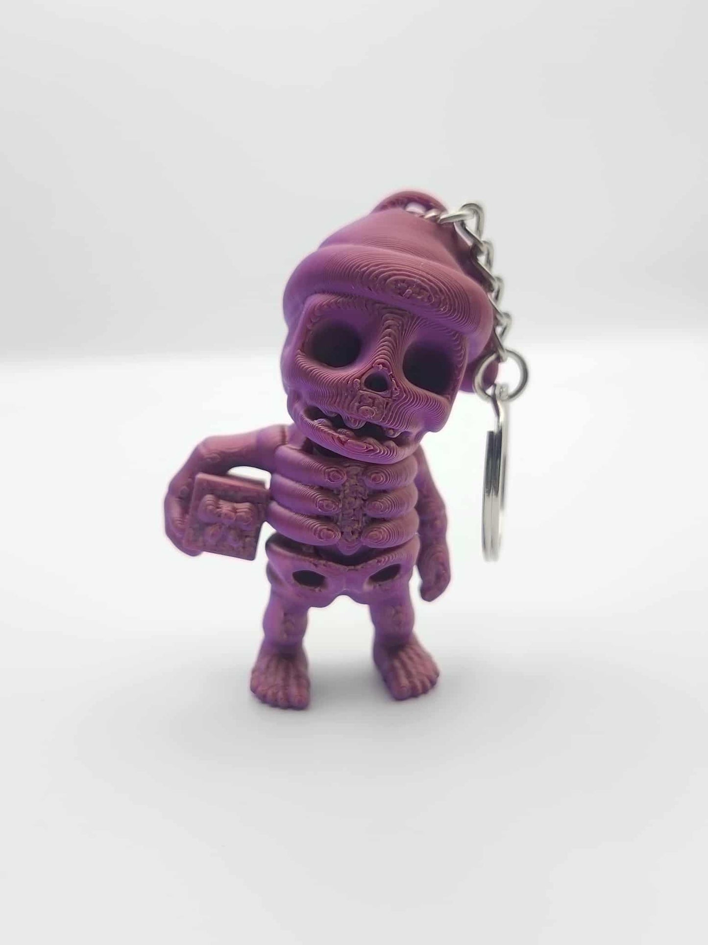 Santa Hat Skeleton Holding Gift Keychain